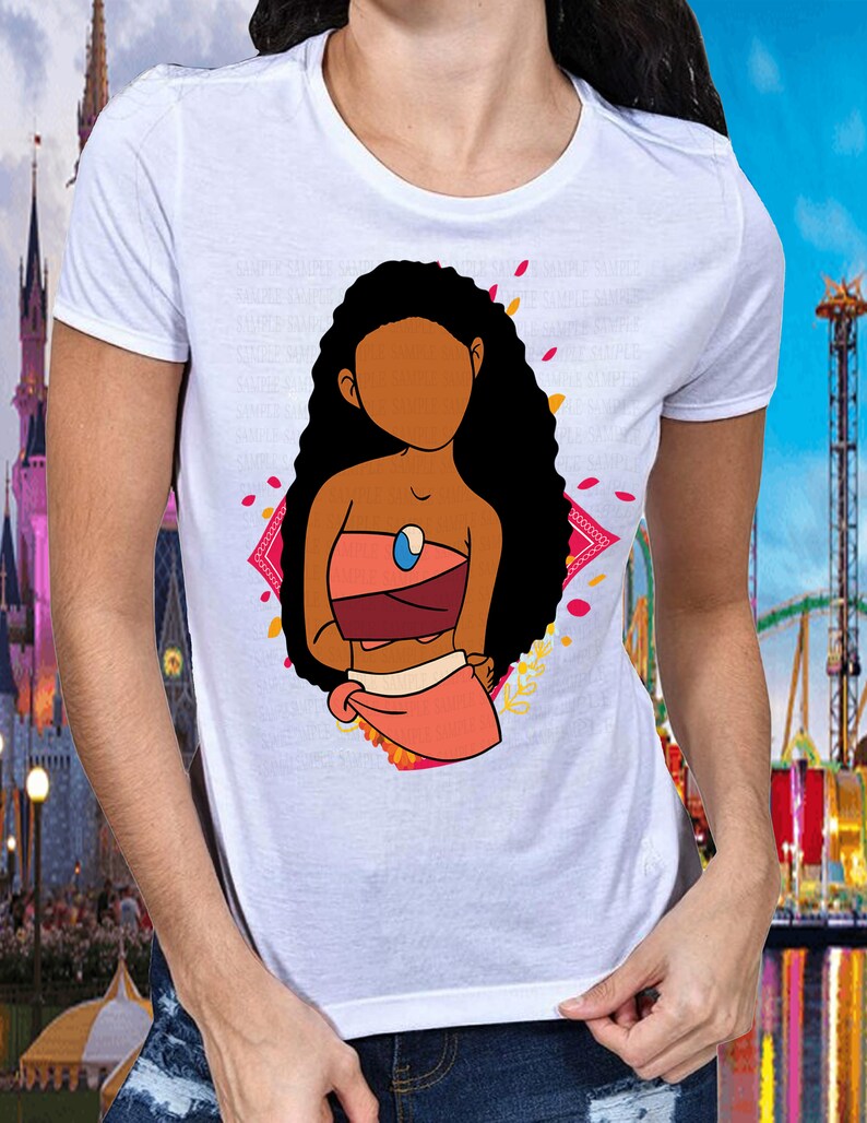 May include: White t-shirt with a cartoon illustration of a brown-skinned woman with long black hair wearing a pink and red outfit. The woman is standing in front of a pink and yellow floral design.