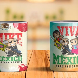 May include: Two white ceramic mugs with black handles. The mug on the left has a cartoon image of a man with a mustache and a flag that says "Viva Mexico Independencia". The mug on the right has a cartoon image of four people with a flag that says "Viva Mexico Independencia".