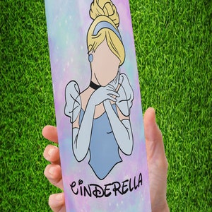 May include: A stainless steel tumbler with a galaxy-like background featuring a cartoon image of Cinderella in a blue dress with the word "Cinderella" printed below her.