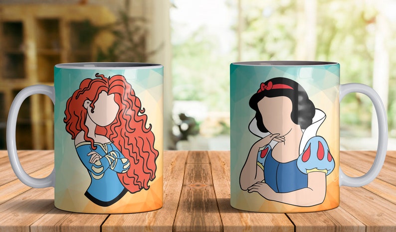 May include: Two white ceramic mugs with a gray rim. The mug on the left features a cartoon illustration of Merida from Brave with long red hair. The mug on the right features a cartoon illustration of Snow White with black hair and a red bow. Both mugs have a yellow, orange, and blue background.