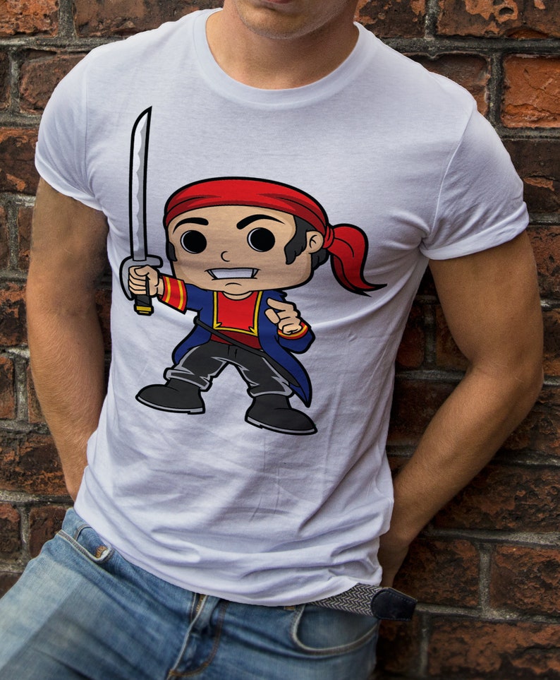 May include: White t-shirt with a cartoon illustration of a pirate holding a sword. The pirate is wearing a red bandana, blue jacket, and black pants.