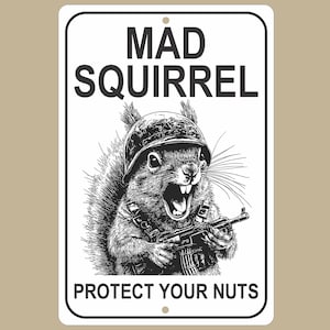 May include: A white rectangular metal sign with rounded corners. The sign features a black and white illustration of a squirrel wearing a military helmet and holding a machine gun. The words "MAD SQUIRREL" and "PROTECT YOUR NUTS" are printed in black.