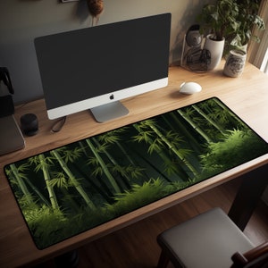 May include: A green and black bamboo forest design mouse mat on a wooden desk with a computer monitor, a coffee maker, and a pair of headphones.