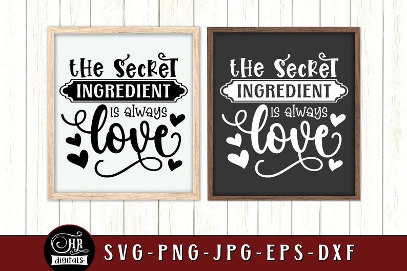 May include: Two black framed signs with white backgrounds and white text. The text on the signs reads "The Secret Ingredient is always love".