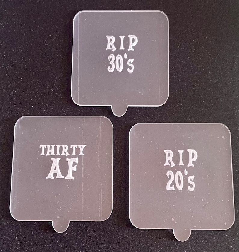 May include: Three clear plastic square-shaped signs with white text. The signs read "RIP 30's", "RIP 20's", and "THIRTY AF".