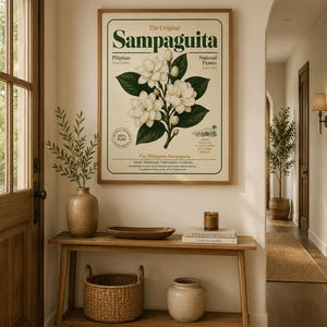 May include: A framed botanical wall art print titled The Original Sampaguita, featuring a detailed illustration of white Sampaguita flowers with green leaves on a cream background, surrounded by text including Pilipinas and National Flower.
