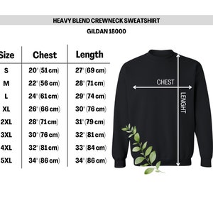 May include: A black crewneck sweatshirt size chart for Gildan 18000. The chart lists sizes S through 5XL with corresponding chest and length measurements in inches and centimetres. A black sweatshirt illustration shows chest and length arrows.