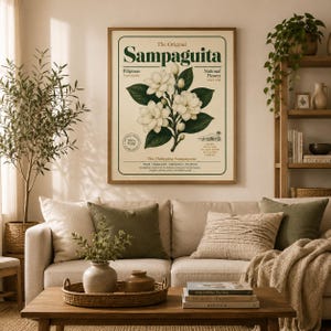 May include: A framed botanical wall art print featuring a central illustration of white Sampaguita flowers with green leaves. The text reads The Original Sampaguita, Pilipinas National Flower, and includes descriptive details about the plant.