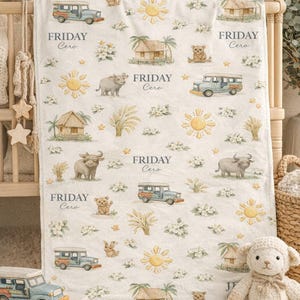 May include: A white baby blanket with a repeating pattern of a blue jeepney, sun, hut, bear, and water buffalo. The text "FRIDAY Cero" is printed on the blanket. The blanket is surrounded by stuffed animals.