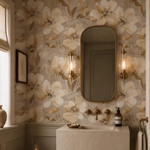 May include: A bathroom interior featuring floral wallpaper in beige and gold tones, a rectangular stone wall-mounted sink, a brass faucet, and an oval mirror. Two cylindrical wall sconces flank the mirror, with a wooden stool and towel nearby.