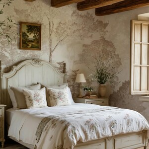 May include: A cream-coloured wooden bed frame with a curved headboard and footboard, dressed in a white duvet cover featuring a delicate floral pattern, two matching floral throw pillows, and two solid cream-coloured pillows on a woven rug.