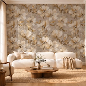 May include: A wall mural featuring a repeating pattern of large, painterly flowers in shades of cream, beige, and soft gold against a muted taupe background. The floral design includes delicate petals and foliage with subtle metallic gold accents.
