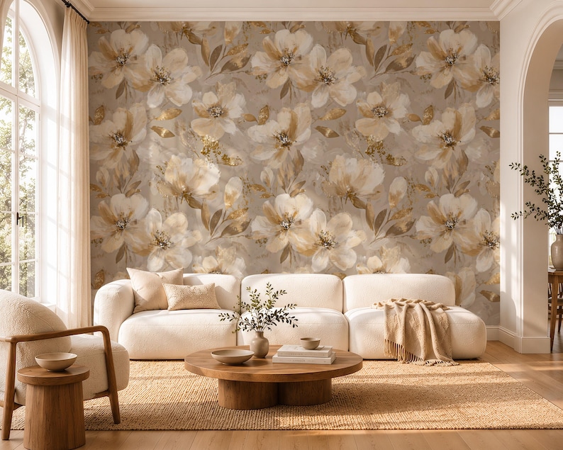 May include: A wall mural featuring a repeating pattern of large, painterly flowers in shades of cream, beige, and soft gold against a muted taupe background. The floral design includes delicate petals and foliage with subtle metallic gold accents.