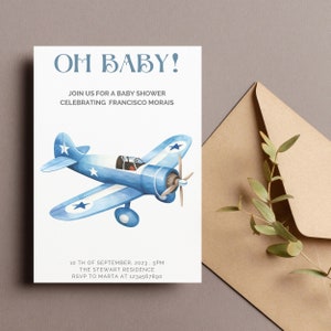 May include: A blue and white airplane with stars on the wings, a baby shower invitation with the text "Oh Baby!" and "Join us for a baby shower celebrating Francisco Morais". The invitation also includes the date, time, location, and RSVP information.