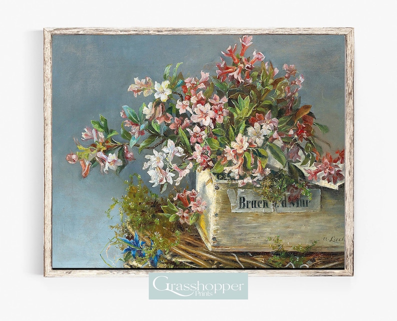 Peut inclure: Une peinture vintage repr&eacute;sentant un bouquet de fleurs roses et blanches dispos&eacute;es dans une bo&icirc;te en bois avec le texte "Bruch d. Mur" sur le devant. Les fleurs sont entour&eacute;es de feuilles vertes.