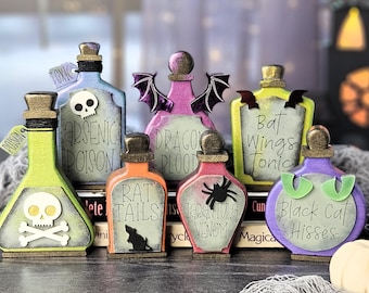 May include: A collection of seven decorative potion bottles in various shapes and colors, featuring labels with text such as Arsenic Poison, Dragon Blood, Bat Wings Tonic, Rat Tails, Tarantula Venom, and Black Cat Hisses, with themed accents.
