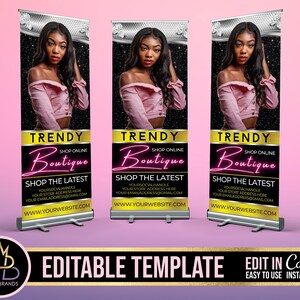 May include: A black and gold retractable banner with a pink and white design. The banner features a woman with long black hair and a pink shirt. The text on the banner reads "TRENDY Boutique Shop Online Shop the Latest Your Social Handle Your Store Address Here Your Email Address@email.com www.yourwebsite.com".
