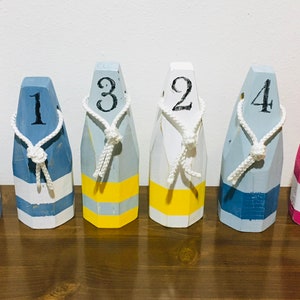Custom Painted Wood Buoys Distressed to Appear Aged