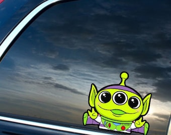 Pegatina de vinilo de bebé extraterrestre que mira fijamente