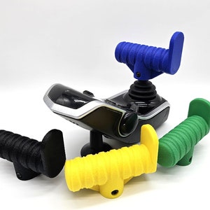 May include: Four different colored joystick handles. The handles are made of a textured rubber-like material. The handles are blue, black, yellow, and green.