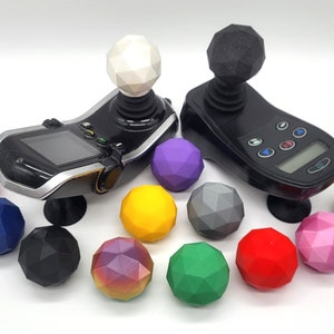 May include: A set of 12 colourful, geometric joystick balls for gaming controllers. The balls are made of a durable plastic and come in a variety of colours, including pink, purple, blue, green, yellow, and black. The balls are designed to fit most standard joystick controllers.