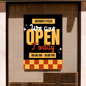 May include: A black and yellow sign with the text "Antonio's Pizza" and "We are open today 08:00 AM - 10:00 PM" in a storefront window.