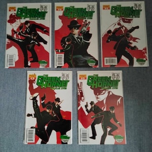 May include: Five comic books featuring The Green Hornet, a superhero with a green mask and a black suit. The covers feature the Green Hornet and his sidekick Kato in action poses. The comic books are numbered 1-5.