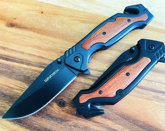 Navaja de bolsillo plegable táctica con resorte de 8,5", color negro. Mango de madera de acero inoxidable.