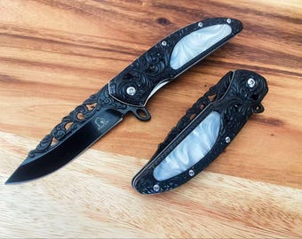 Vintage Style Assisted Folding Knife: Black Florals, White Handle