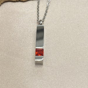 Silver Cremation Urn Necklace: Stainless Steel Bar with Red Birthstone