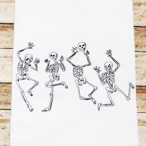 May include: Four black and white skeleton figures dancing on a white background. The skeletons are in various poses, with their arms and legs outstretched.