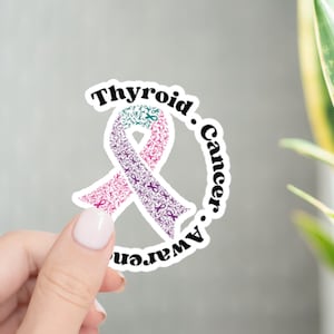May include: White sticker with a purple and teal ribbon made of smaller ribbons. The text around the ribbon reads "Thyroid Cancer Awareness."
