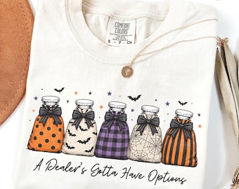 T-shirt d'infirmière scolaire pour Halloween, T-shirt vendeur de poches de glace, T-shirt humoristique pour étudiante en soins infirmiers, Cadeau pour la saison des frissons, T-shirt pour travailleur médical aux couleurs confortables de l'automne, T-shirt sorcière