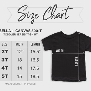 May include: A Bella + Canvas 3001T toddler jersey t-shirt size chart. The chart displays sizes 2T through 5T with corresponding widths and lengths in inches. A black t-shirt is shown with arrows indicating the width and length measurement points.