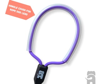 May include: Purple handle cover for a rope dog lead. The cover is made of a clear, flexible material with a purple inner lining. The handle has a black connector with a small elephant logo.