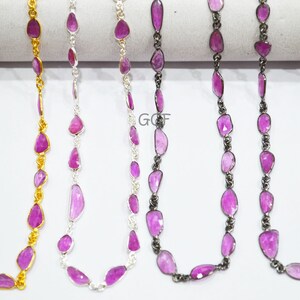 May include: Four strands of pink gemstone necklaces with different metal chain styles. The chains are gold, silver, and two different shades of silver.