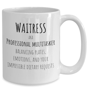 May include: White ceramic mug with the text "Waitress AKA Professional Multitasker Balancing Plates, Emotions, and Your Impossible Dietary Requests" in black. The mug has a curved handle.