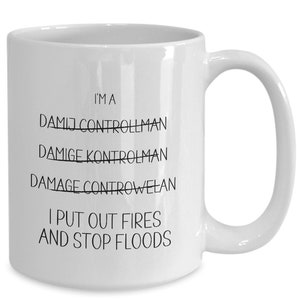 May include: White ceramic coffee mug with black text that reads "I'm a Damage Control Man I put out fires and stop floods". The words "Damage Control Man" are crossed out.