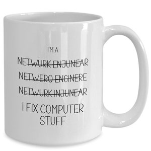 May include: White ceramic coffee mug with black text that reads "I'm a Network Engineer I fix computer stuff". The word "Network" is crossed out twice.