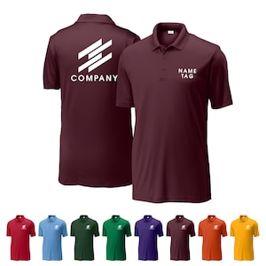 May include: Burgundy polo shirt with a white logo on the back and the text "NAME TAG" on the front. The shirt has a collared neckline and short sleeves. Additional shirts in red, blue, green, purple, brown, orange, and yellow are displayed below.