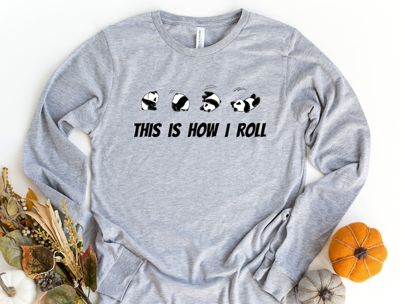 May include: Gray long-sleeve shirt with a graphic of five pandas rolling, and the text "This is how I roll".