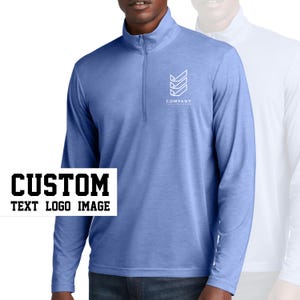 May include: A light blue long-sleeved shirt with a mock neck and a zipper. The shirt has a white logo on the chest that says "COMPANY" with a geometric design.