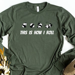 May include: A green long-sleeved t-shirt with a graphic of five pandas rolling, and the text "This is how I roll".