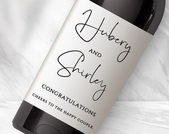 May include: A wine bottle with a personalised label that says "Hubery and Shirley Congratulations Cheers to the Happy Couple."