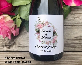 May include: A white wine bottle label with a floral design and the text "Hannah & Johnson Cheers to forever 09. 20. 2022".