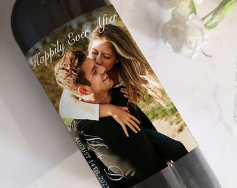 May include: A wedding wine bottle label featuring a photograph of a couple, the text "Happily Ever After" and the date "August 14th, 2023".