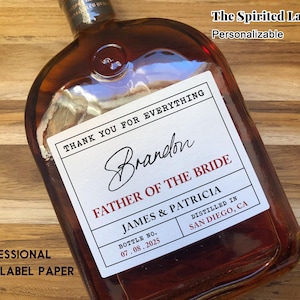 May include: A white personalized wine bottle label with black text that reads "Thank you for everything Brandon Father of the Bride James & Patricia Bottle No. 07.08.2025 Distilled in San Diego, CA".