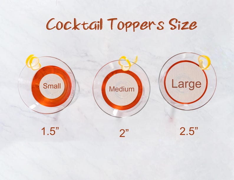 May include: Three cocktail toppers in different sizes: small (1.5 inches), medium (2 inches), and large (2.5 inches). Each topper is a round, orange-colored disc with a white circle in the center.