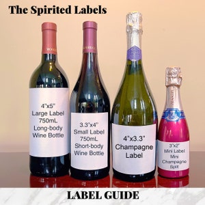 May include: Four wine bottles with labels showing different sizes and types of wine bottles. The labels include measurements in inches. The bottles are on a wooden surface. The text on the labels reads: "The Spirited Labels", "4"x5" Large Label 750mL Long-body Wine Bottle", "3.3"x4" Small Label 750mL Short-body Wine Bottle", "4"x3.3" Champagne Label", "3"x2" Mini Label Mini Champagne Split".