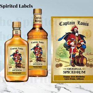 May include: Two bottles of Captain Morgan spiced rum with custom labels featuring a cartoon pirate and the text "Captain Louis - Original Spiced Rum - Happy 21st Birthday - Love from, Allison".